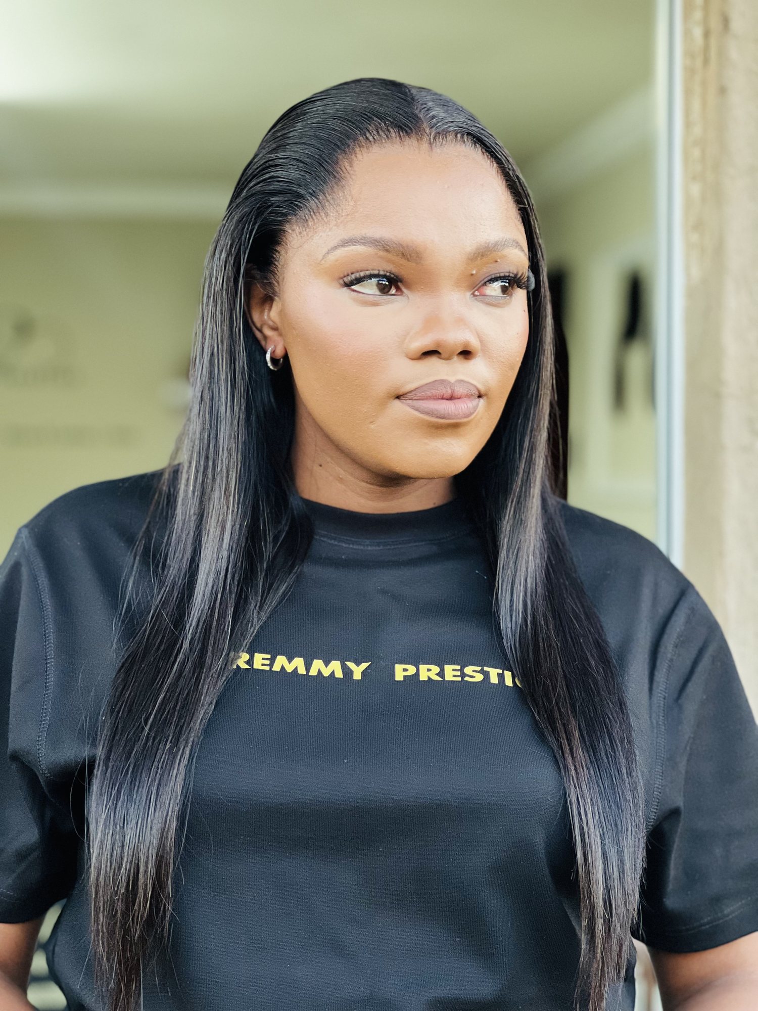Premmy Prestige founder wearing a sleek straight wig